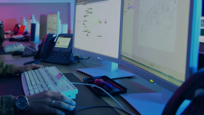 OSINT advisory and capability development image showing an analyst working on investigative network analysis tools